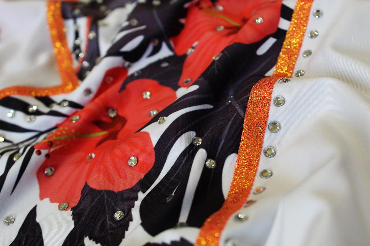 Купальник женский для спортивной гимнастики Darcy Honululu 4238 белый с оранжевым рисунком без рукава